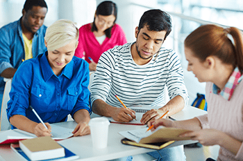 Group of students studying and taking notes